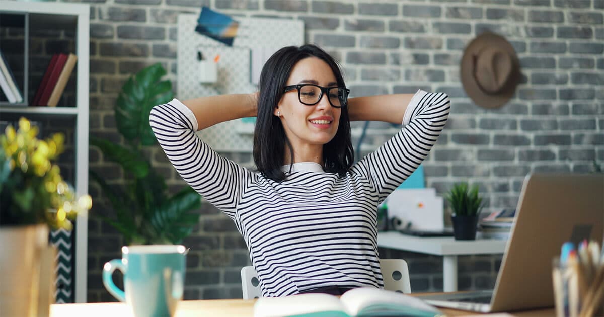 A woman sits at a desk