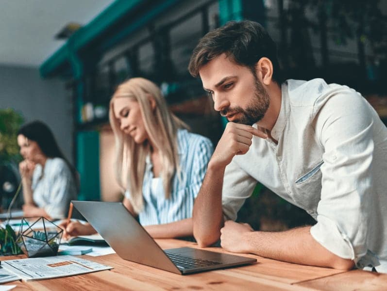 Group of young business people are working together in modern office.