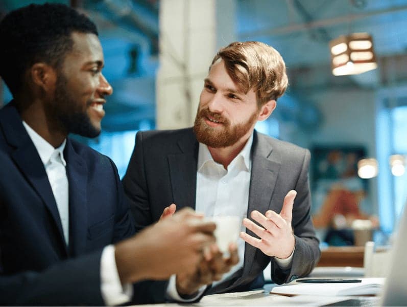 Young professionals discussing ideas and planning work.