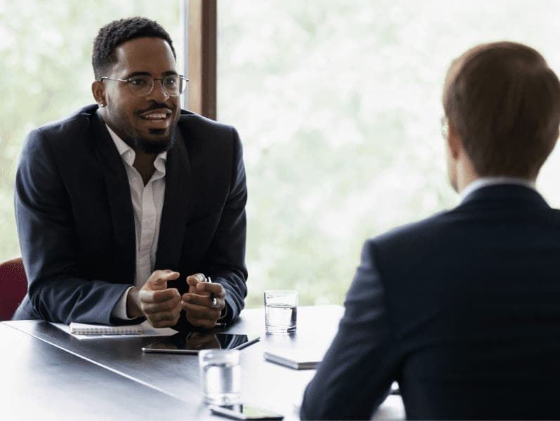 Confident manager giving consultation to client on meeting.