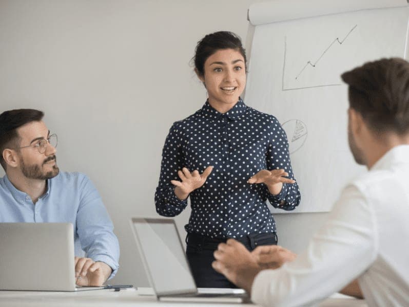 Business trainer give presentation explanation to company staff.