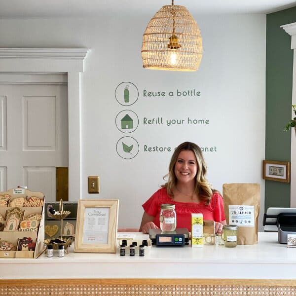Image of a cashier behind the desk at Love Thy Nature
