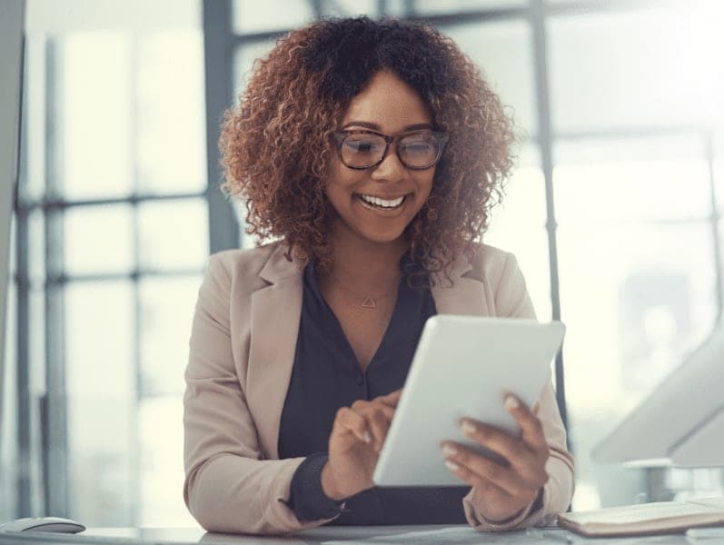 Young businesswoman using a digital tablet at work.
