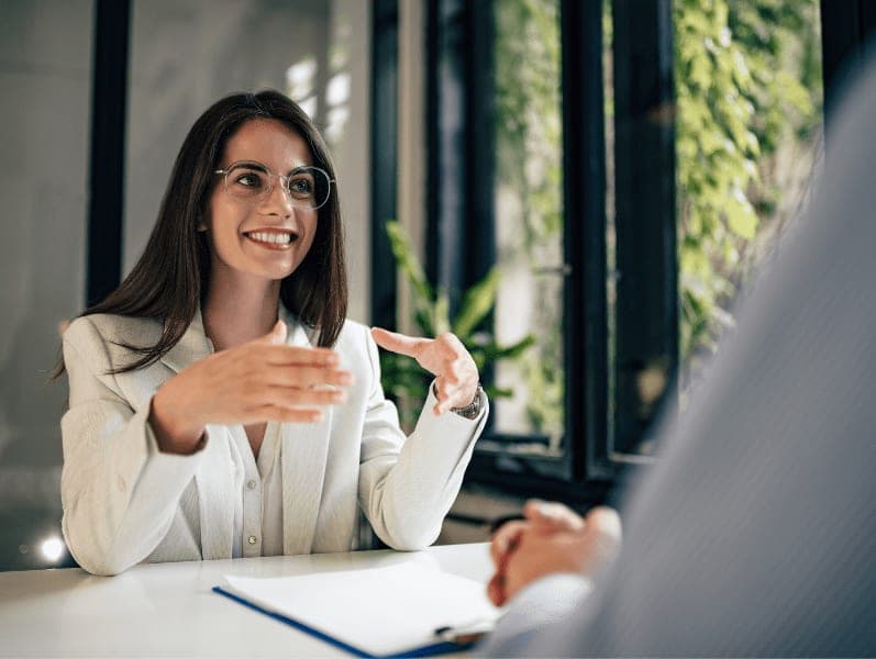 Beautiful female financial adviser talking to a client.