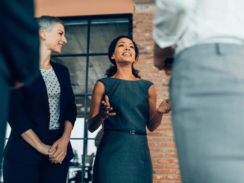 Talking and smiling business people.