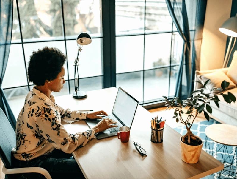 Busy business woman working from home office.