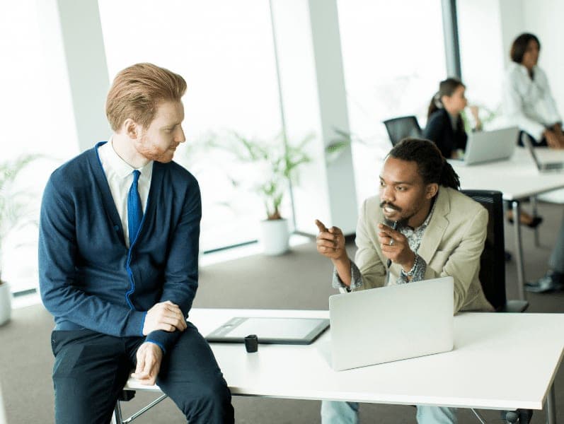 Two business people working together in the office.