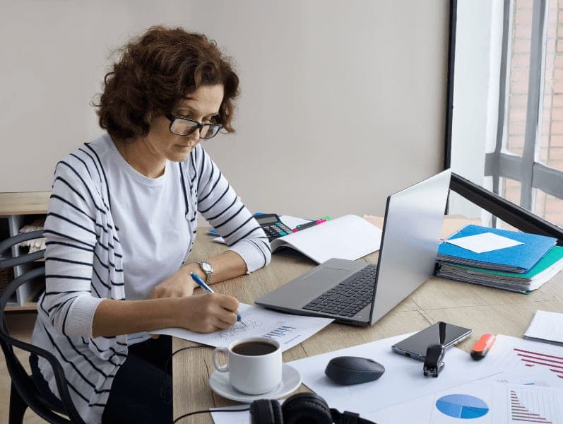 Female accountant is working from home.