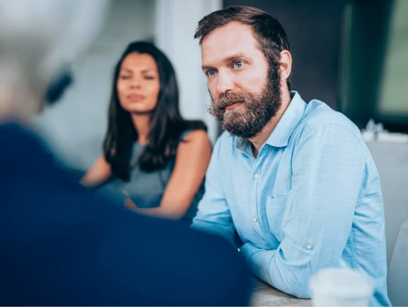 Manager discussing business to employees.