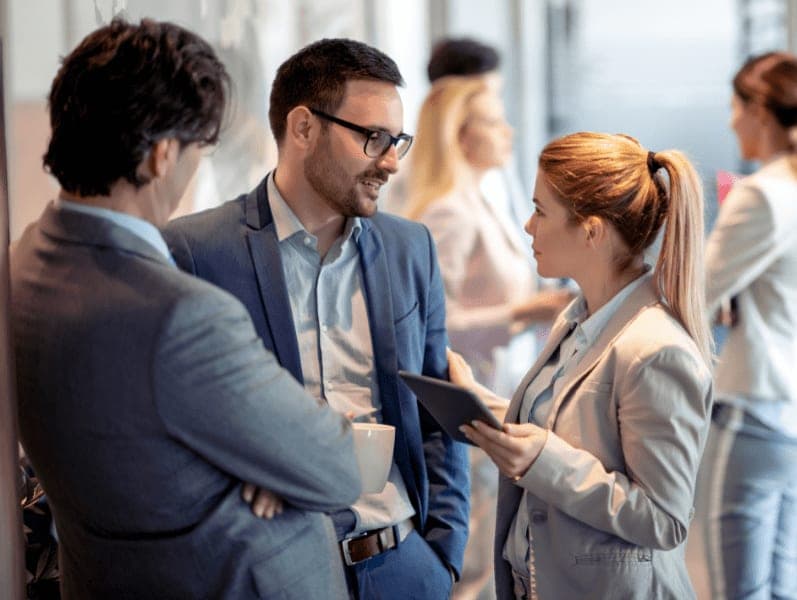 Business people having conversation during coffee break.
