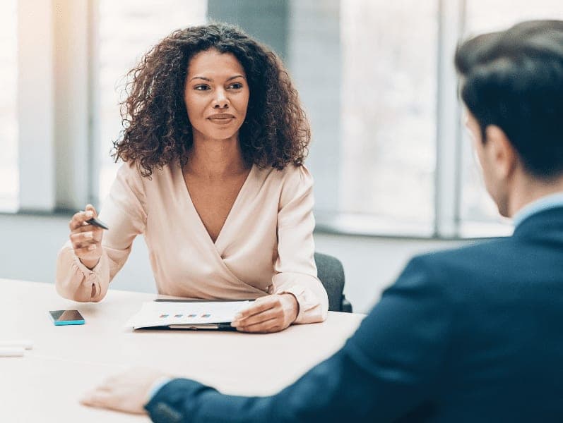 Smiling businesswoman, having conversation with a client.