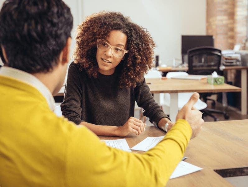 Two business people in a meeting.