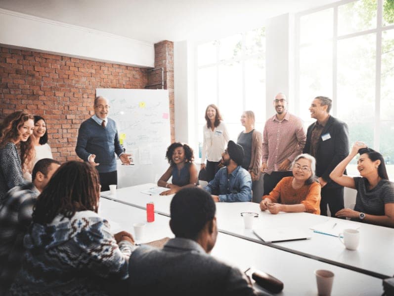 Diverse group of people talking and sharing ideas in the conference room