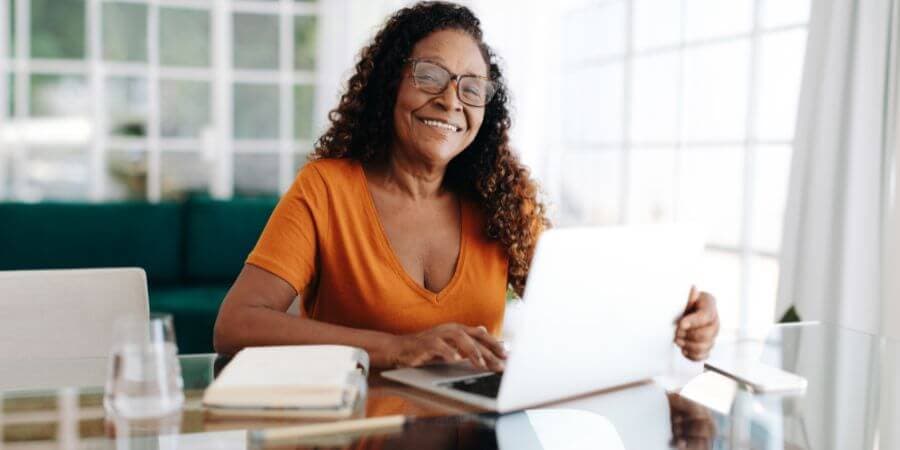 A woman works on a laptop