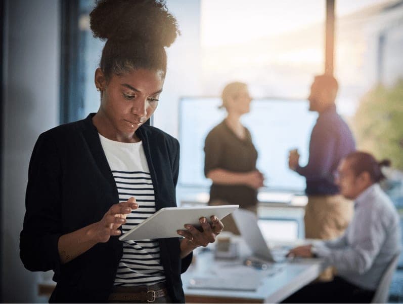 Young businesswoman using a digital tablet.