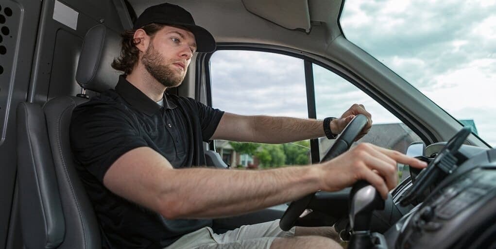 A man drives a truck.