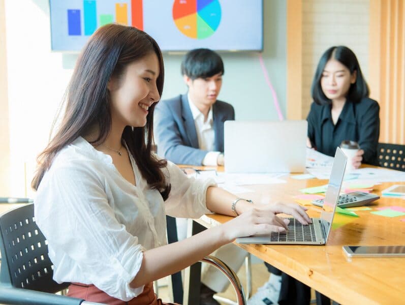 Team of collogues reviewing blockchain and its accounting clients