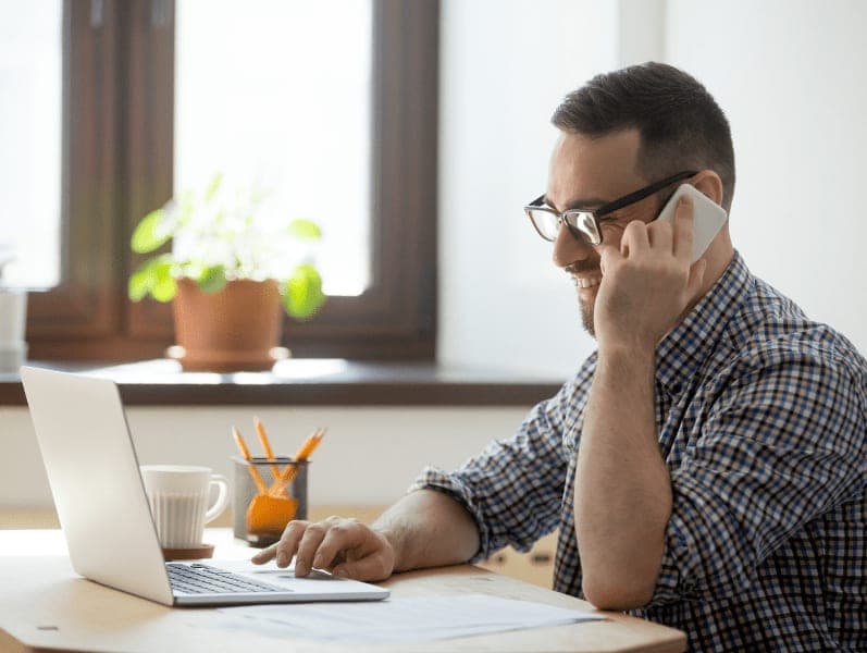 Male accountant walking a client through LLC and S Corp options