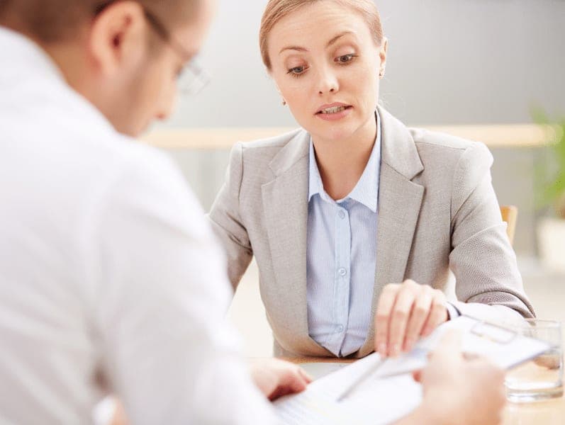 Female accountant consciously advising a client.