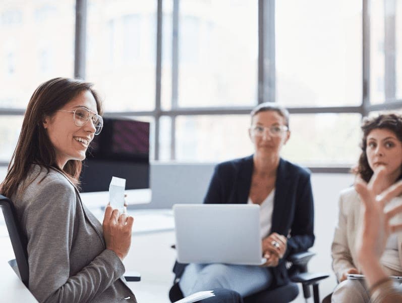 Business people having a meeting in an open office.