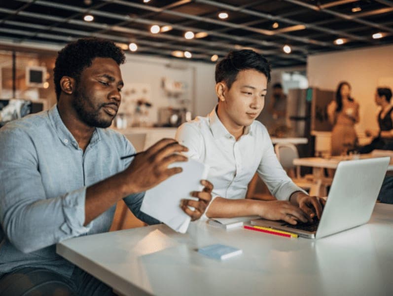 Group of people working together in modern firm office.