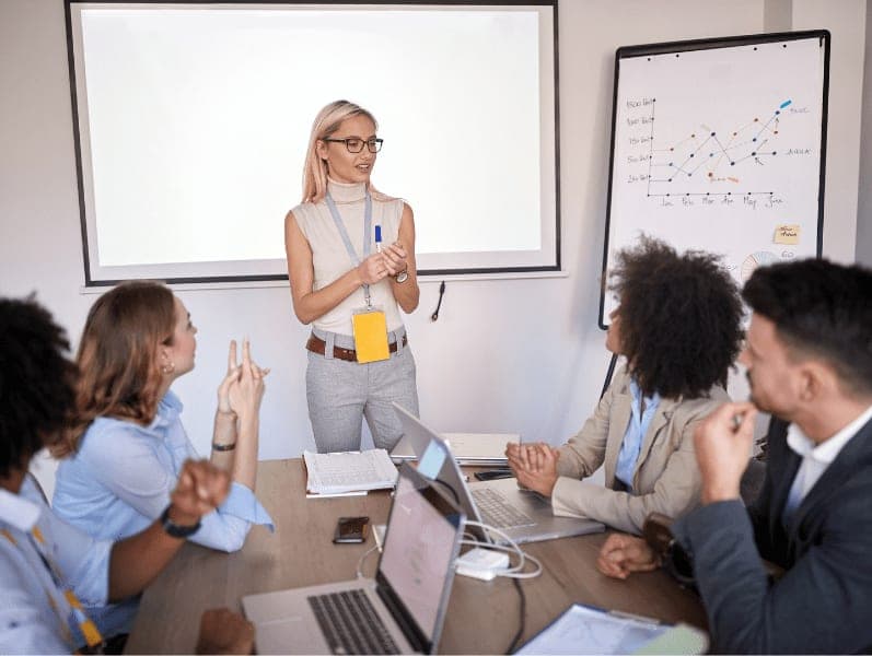 Young woman leading a conference meeting.