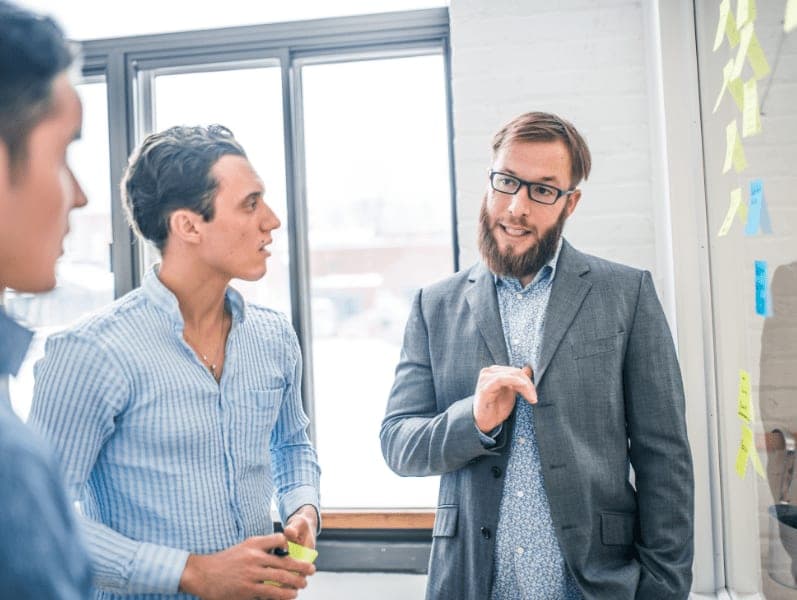 Three business people having a meeting in their office.