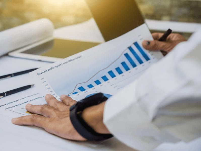 Businessman checking business profit result report in office.