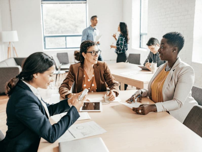 Multi-ethnic group having a discussion in a coworking space