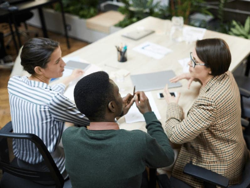 High angle view at multi-ethnic group of young business people working together in office