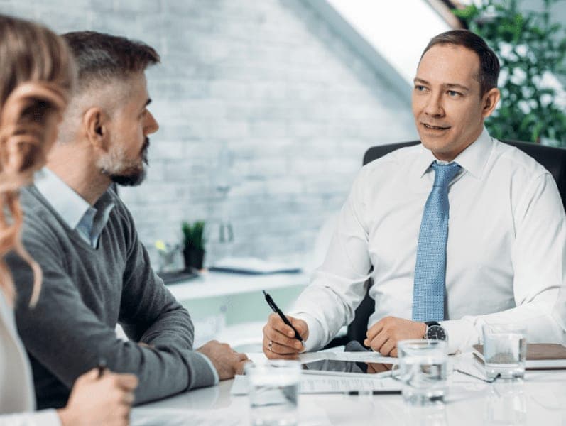 Business advisor talking with his clients in the office