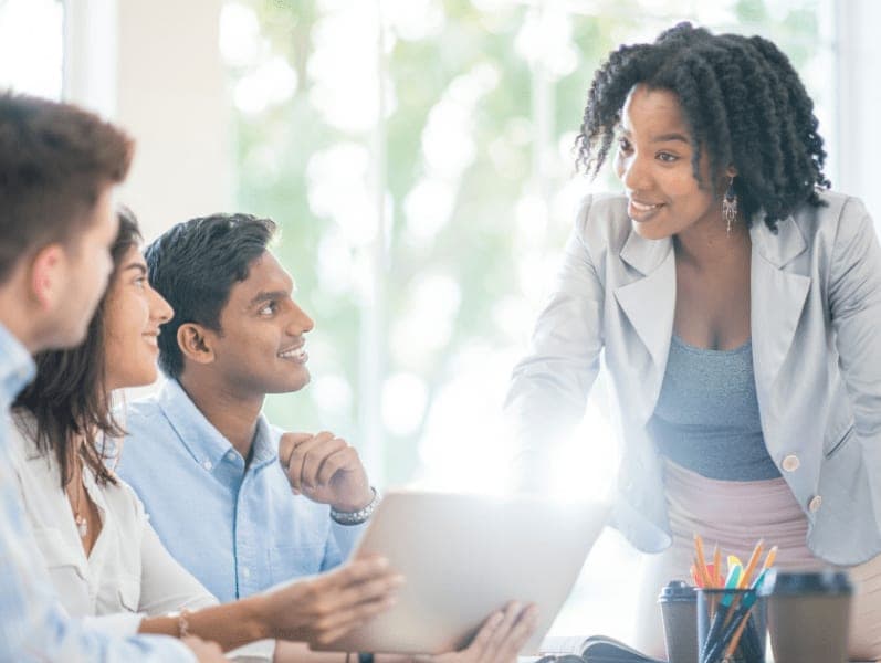 Multi-ethnic group of business professionals working together and having a discussion