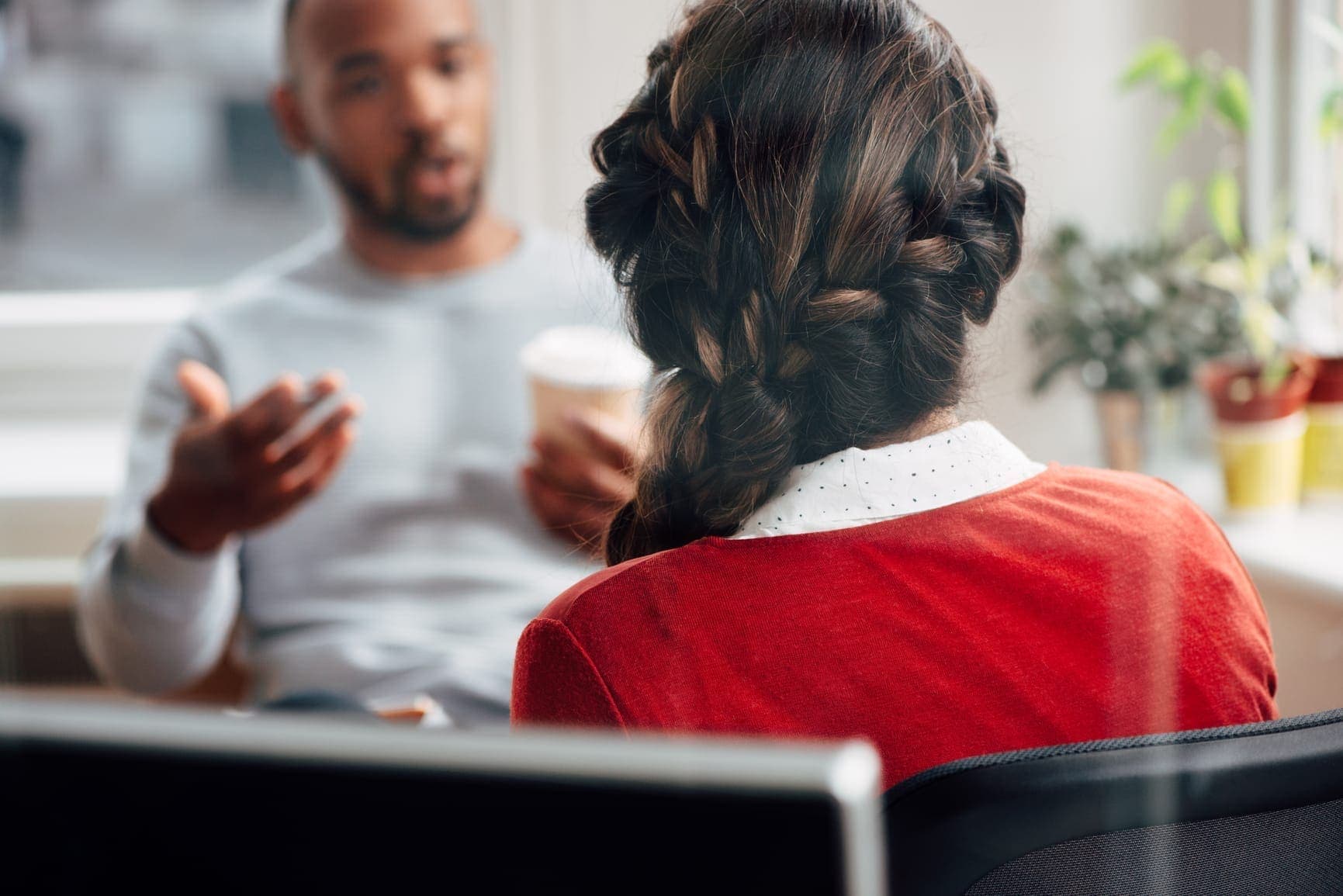 Female ICF-accredited coach and accountant advising a client.