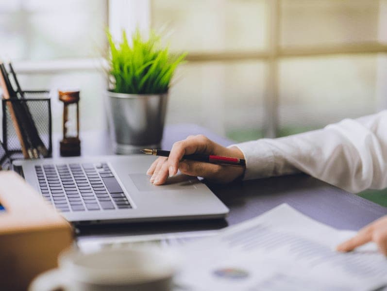 Man sitting his desk reviewing how blockchain is impacting his clients