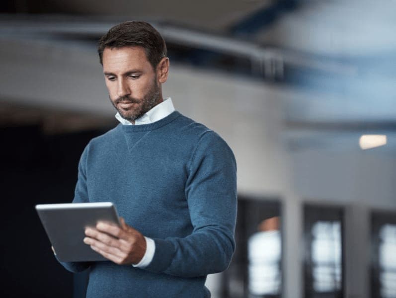 Man incorporating cloud workflow on tablet