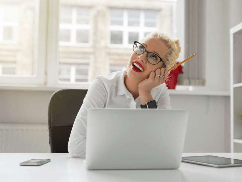 Owman sitting at her desk dreaming of how she will advance her career