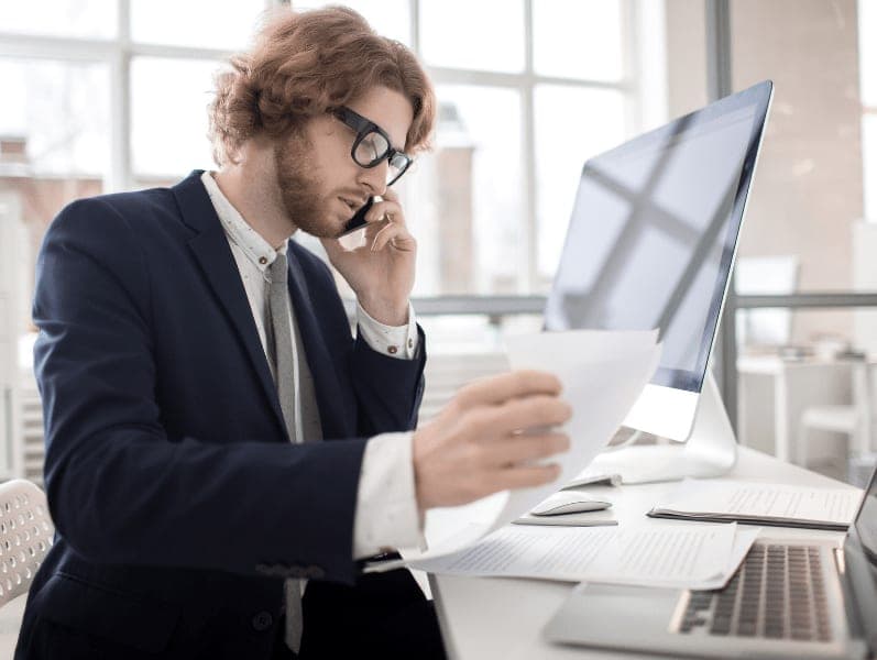 Male accountant working at his desk.