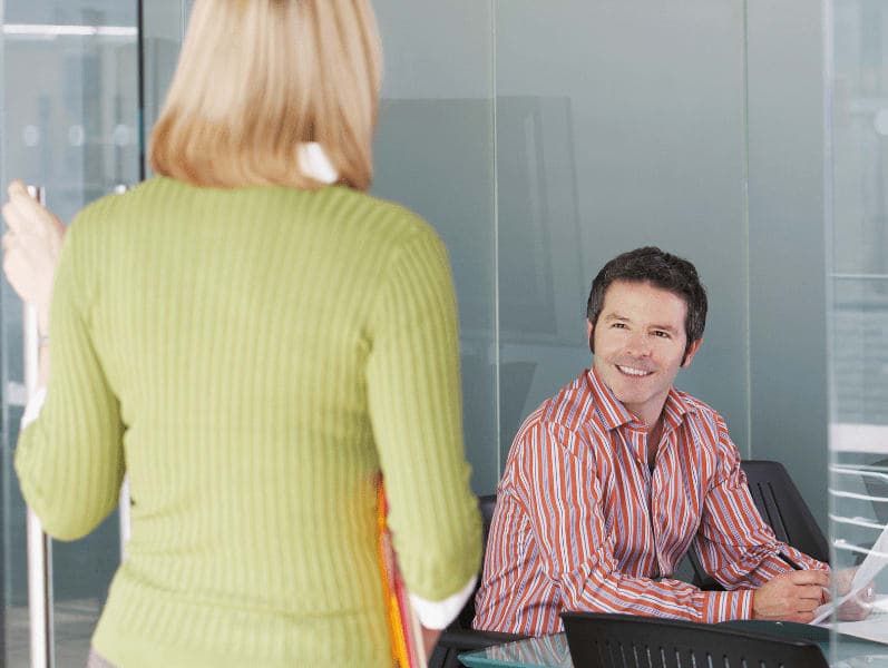 Two accountants engaging in a dialogue about a work issue.