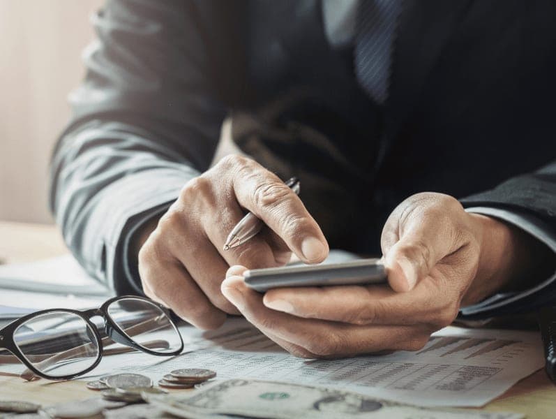 Male accountant working on finance calculations.